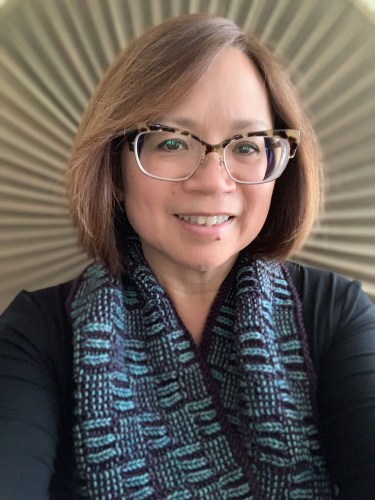 Woman wearing knit garter and brioche cowl