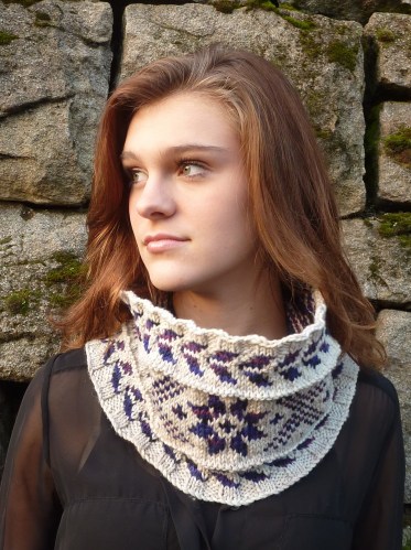 Young woman wearing snowflake colorwork cowl
