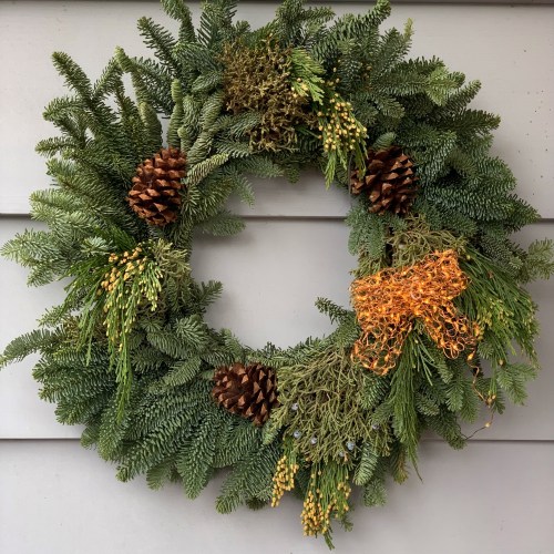 christmas wreath with knitted bow made from wire lights
