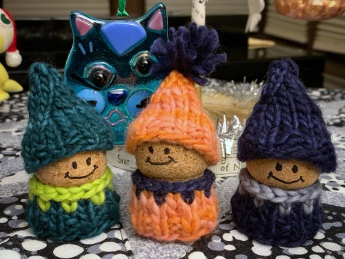 3 korknisse wearing sweaters and hats knit with malabrigo worsted