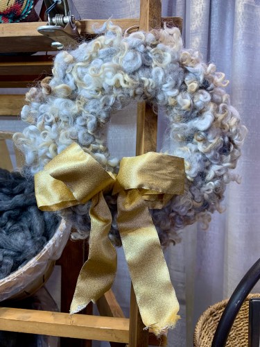 Knitted wreath with wool locks knit in
