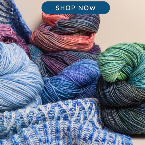 Colorful yarn and a peek at a brioche knit shawl