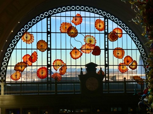 Window at federal courthouse in Tacoma Washington featuring large orange glass flowers