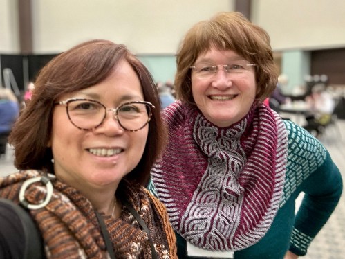 two women wearing brioche knit accessories