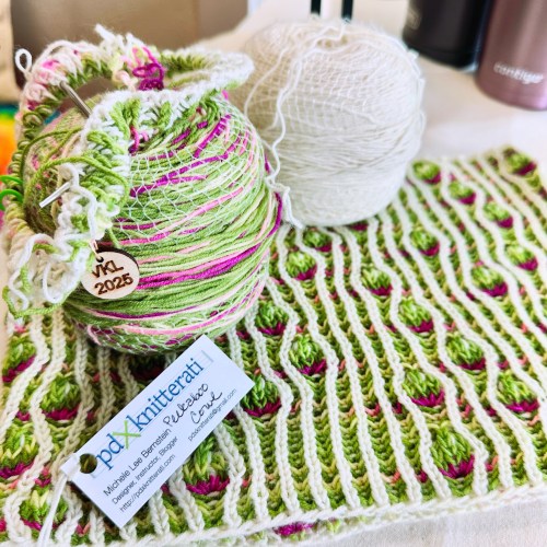 Brioche cowl featuring assigned pooling/algorithmic knitting