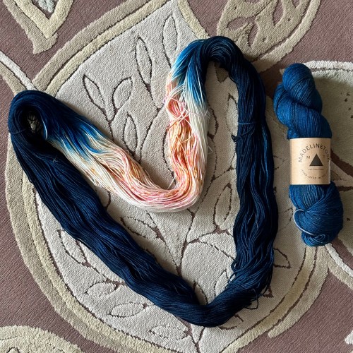2 skeins of yarn; one is dyed for assigned pooling