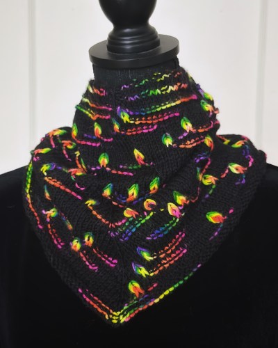 Black hand knit cowl featuring assigned pooling color motifs