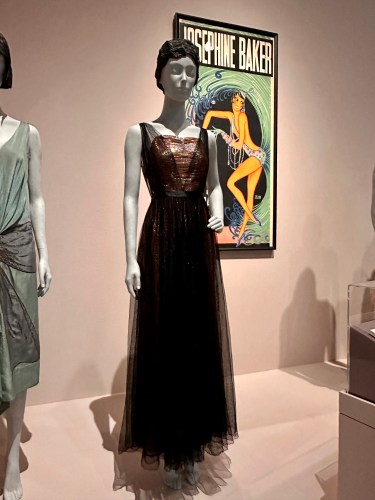 Coco Chanel, 1937. The whole sheath dress is covered in flexible gelatin sequins, covered with a net overskirt and bodice.