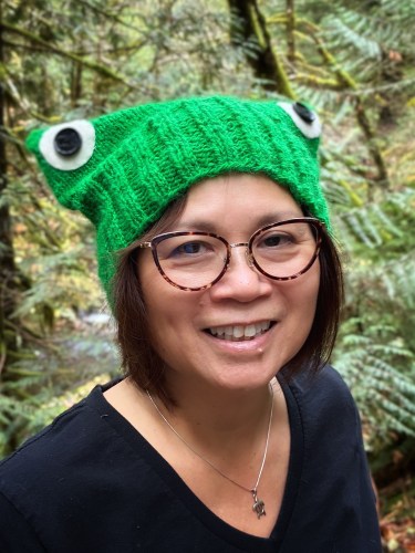 woman wearing a green knit hat