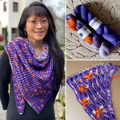 a purple brioche shawl with orange stars
