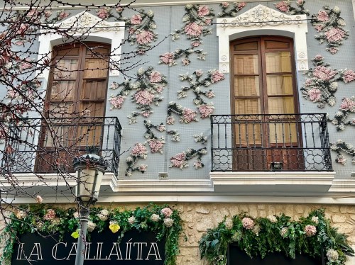 Faux needlepoint on building