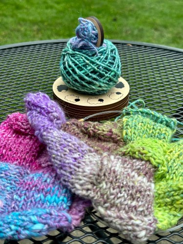 knitting and yarn on a yarn carousel from twice sheared sheep