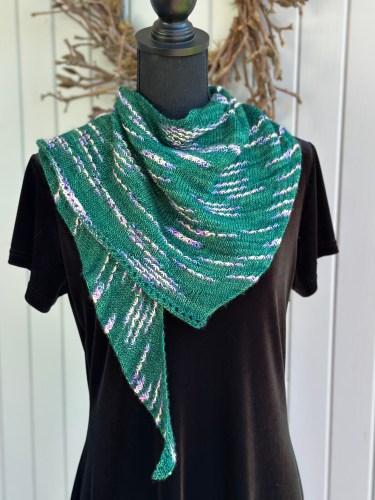 a green shawlette with assigned pooling motifs